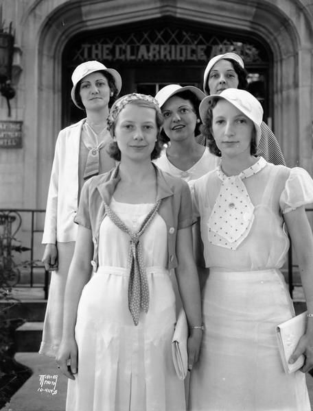 Group portrait of women posing for a Lux soap publicity drive on the steps in front of the Clarridge Apartments.
