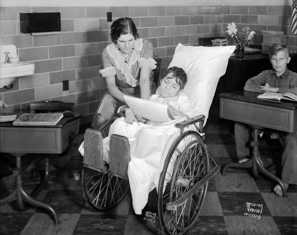 Girl in wheelchair with teacher at Wisconsin Orthopedic Hospital for Children, University of Wisconsin, 436 North Randall Street.