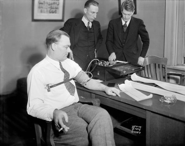 Technicians administer a lie detector test at District Attorney Fred Risser's office to be used in the James Corcoran poisoning case.