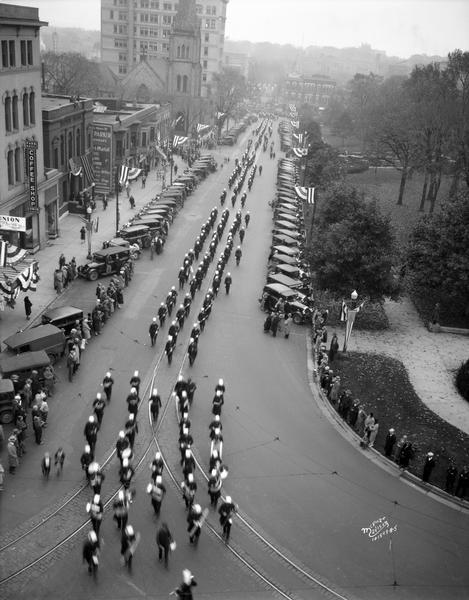 Elevated view of the Knights Templar parade south on Carroll Street during the Wisconsin Commandery convention.