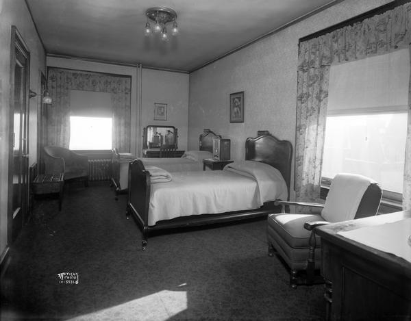 Interior view of a Park Hotel guest room with twin beds.