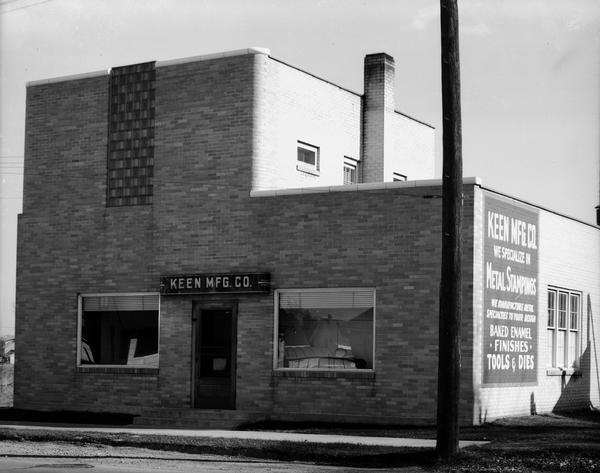 Keen Manufacturing Co., 2661 East Washington Avenue. Sign on side of building: "Keen Mfg. Co. We specialize in Metal Stampings, We manufacture Metal Specialties to your design, Baked enamel finishes, Tools & Dies."