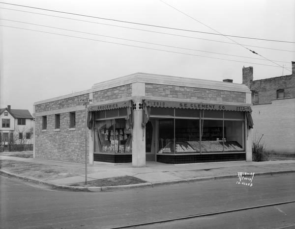 Samuel E. Clement Co. grocery store, 2910 Atwood Avenue, at the corner of Marquette and Atwood Avenue.