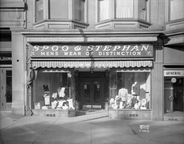Spoo & Stephan, Inc., men's clothing store, 18 N. Carroll Street.