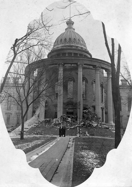In this photograph, probably taken during the early spring, cleanup of the damage to the Wisconsin State Capitol caused by the fire of February 26-27, 1904, is progressing. A contemporary newspaper story reported that the state budgeted $3000 for the cleanup and that it planned to hire a crew of 75 workers.