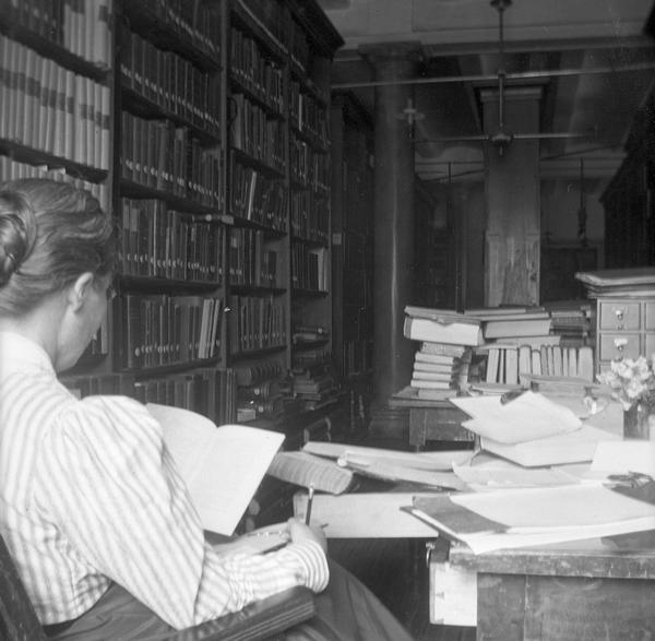 Historian Emma Helen Blair, who supervised the Historical Society's maps and manuscripts collection during the 1890s and who aided the editorial projects of Society superintendent Reuben Gold Thwaites. She is photographed here by Thwaites at her desk in the Historical Society's quarters in the third Wisconsin State Capitol.