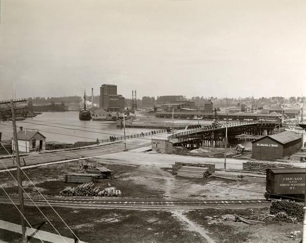 Elevated view of the Chicago & Northwestern Railway yards looking northwest. The elevator of the Northern Grain Company is in the middle distance.