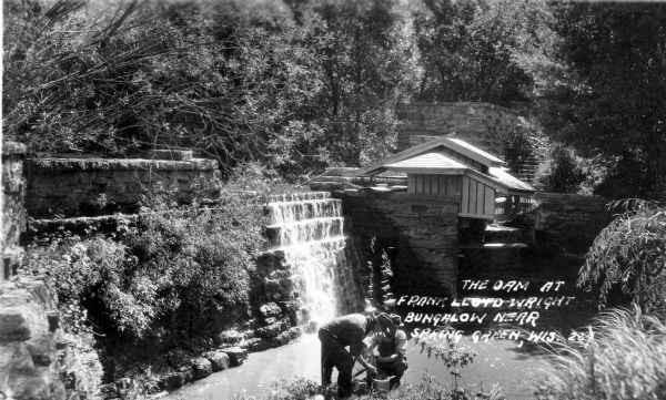 Men working near the dam and hydro house at Taliesin, the summer residence of Frank Lloyd Wright and the Taliesin Fellowship. The hydro house was designed by Wright. Taliesin is located in the vicinity of Spring Green, Wisconsin.