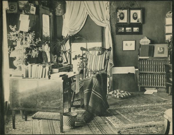Interior view of Aunt Jen's room at Hillside Home School, an early progressive school operated by Ellen and Jane Lloyd Jones, aunts of Frank Lloyd Wright. Contents of the room include a rocking chair and a bookcase.