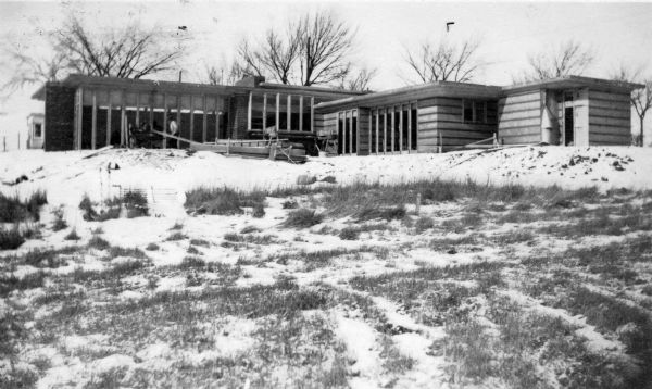 Rear elevation of Herbert Jacobs Residence I, designed by Frank Lloyd Wright, during construction.