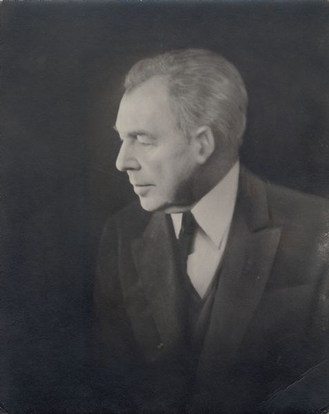 Quarter-length portrait of Frank Lloyd Wright in middle age.