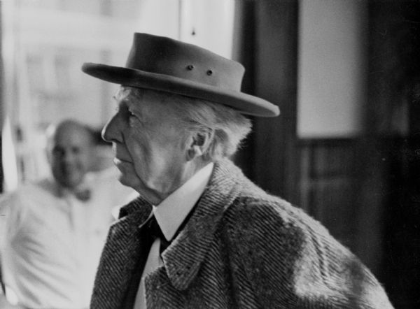 Frank Lloyd Wright, wearing a hat, at the WHA television station.