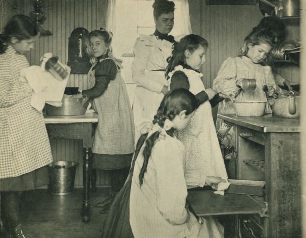 Students in cooking class at Hillside Home School, an early progressive school, operated by  Ellen and Jane Lloyd Jones, aunts of Frank Lloyd Wright.