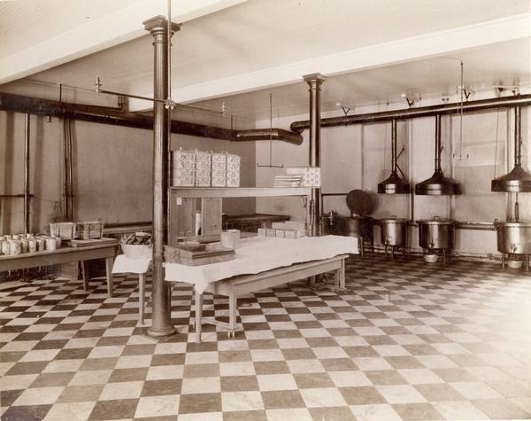 The kitchen in the Northern Hospital for the Insane. Institutional cooking equipment and various supplies are visible.