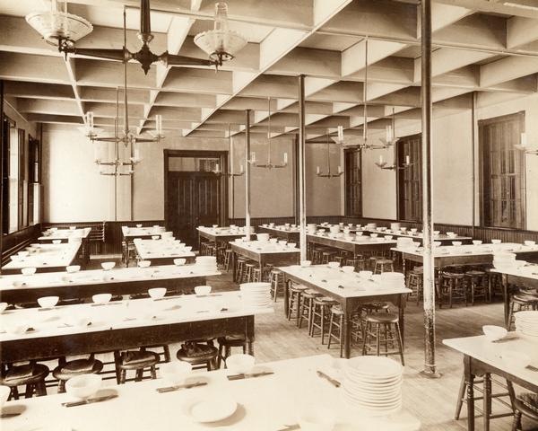 Dining hall at the State Public School, with numerous tables and place settings.