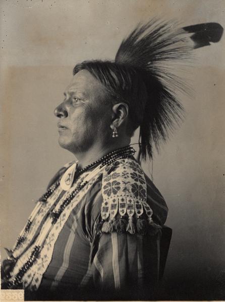 Profile studio portrait of Winnebago man, Charkshepshutsker (Red Eagle), Head Chief. Part of Siouan (Sioux) and Winnebago Tribes.