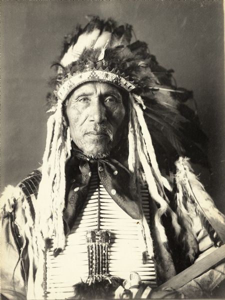 Studio portrait of Yankton Dakota man, Tunwan Ogangan (David Ray). Part of Siouan (Sioux) and Yankton Tribes.