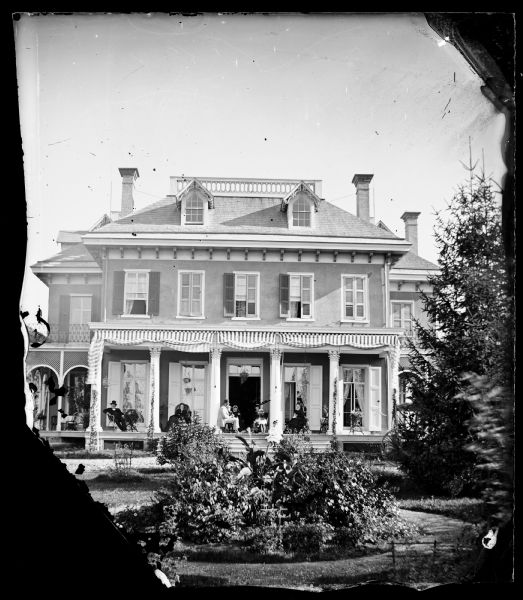 Home of Governor Cadwallader C. Washburn on Monroe Street at the east end of what is now the Edgewood College campus. Washburn is probably the man at left.