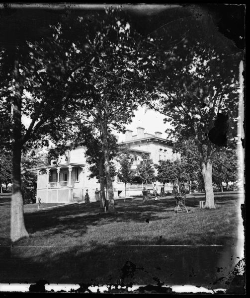 Ole Bull Residence, 130 East Gilman Street. The family is playing croquet on the lawn. Later, the house was known as the Thorp House. It became the state's Governor's Residence when Gov. Jeremiah Rusk sold the house to the state in 1885. In 1950 the house was sold to the University of Wisconsin for the Knapp Graduate Center.