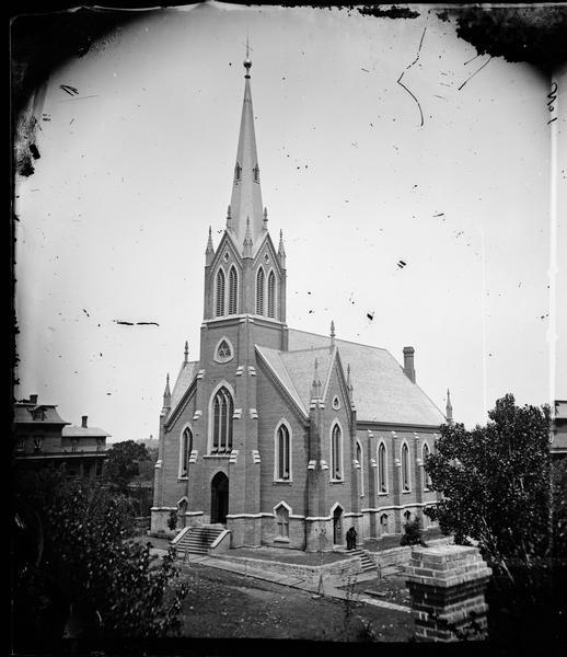 Elevated view of First Norwegian Lutheran Church, with Luther College in the distance. Part of a set of stereographs entitled "The Synod at Decorah, 1876" from Dahl's 1877 "Catalog of Stereoscopic Views."