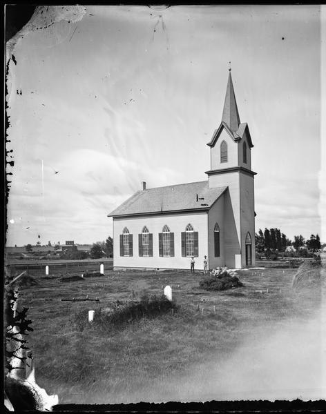 View of the McFarland Lutheran church and cemetery. The church was started in 1869 and in use in 1873.  It was dedicated on January 23, 1876.  The church was served by Jacob Ottesen until 1875 then by Christian Hirstendahl of Stoughton, 1875-1881. A tornado destroyed the church in 1881.