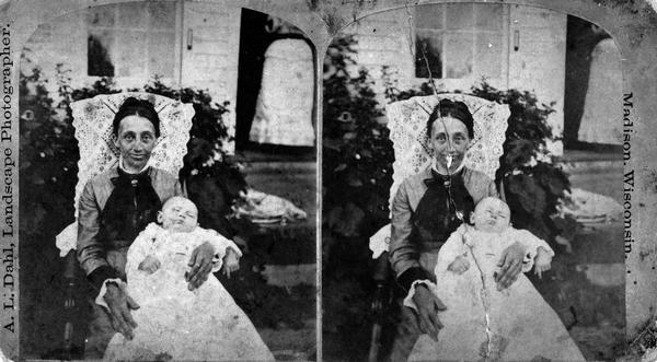 William McFarland's second wife, Sela Nelson McFarland, sitting with her infant son Joseph.