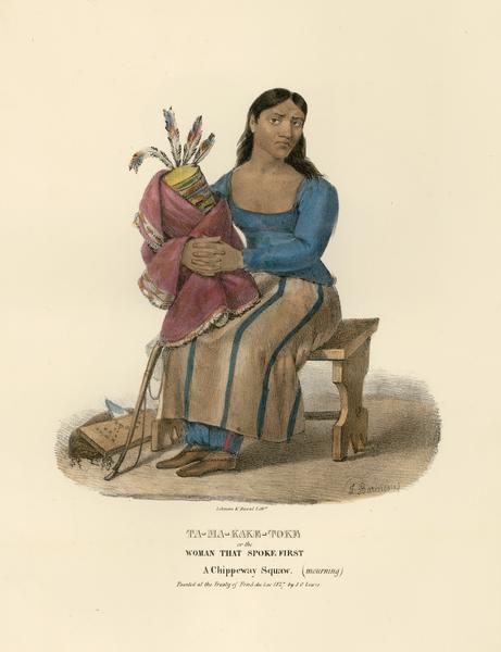 Ta-ma-kake-toke, or the Woman that Spoke First, a mourning Chippeway (Ojibwa) Squaw.  Hand-colored lithograph from the Aboriginal Portfolio, painted at the Treaty of Fond du Lac (1827).
