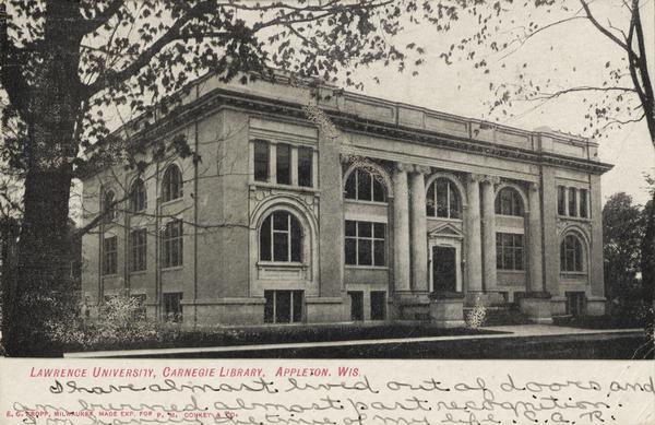 View across lawn toward the library. Caption reads: "Lawrence University, Carnegie Library, Appleton, Wis."