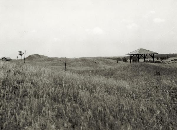 View of the site when it was known as Aztalan Mound Park or Aztalan Mounds, near Lake Mills. There is a pavilion in the right background.