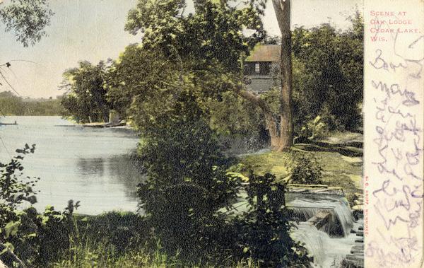 Oak Lodge in Cedar Lake with docks and a small dam. Caption reads: "Scene at Clam Lodge, Cedar Lake, Wis."