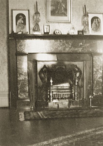View of a fireplace and mantle in Hazelwood, the home of Morgan L. Martin. Morgan Lewis Martin served as county judge of Brown County from 1875 until his death in 1887.