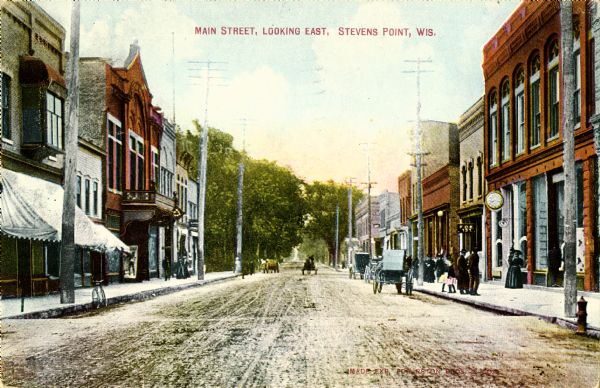View down center of street. Caption reads: "Main Street, Looking East, Stevens Point, Wis."