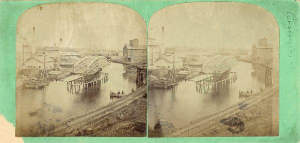 A stereograph of an elevated view of the Root River.