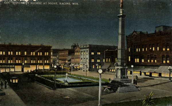 Racine Monument Square at night. Caption reads: "Monument Square at Night, Racine, Wis."