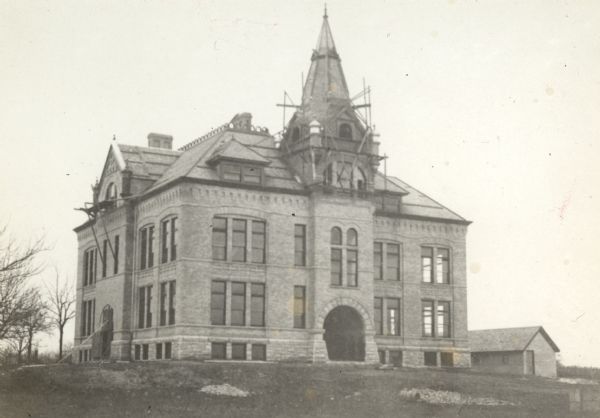 Exterior view of the Lincoln School as it approached its completion. Scaffolding is on the roof.