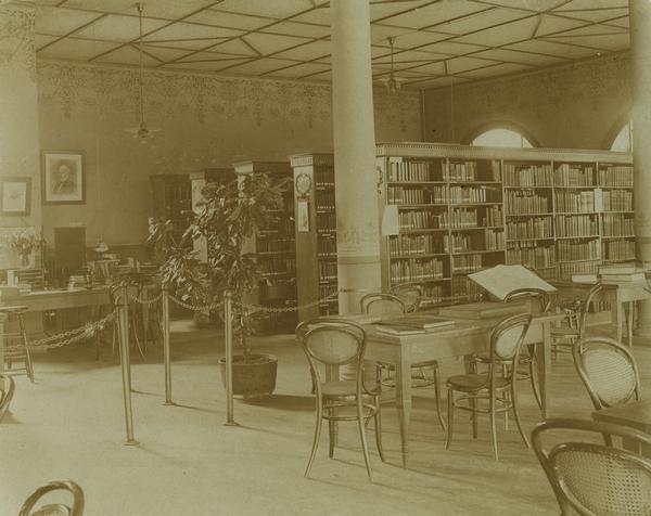 Bookshelves and desks within the Eau Claire Public Library Reading Room.