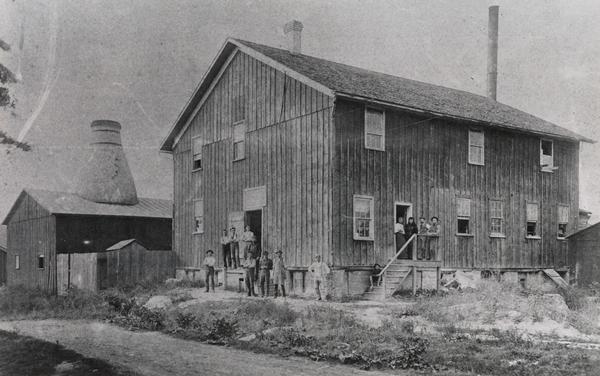 Pauline pottery building. Standing in front are the potters who work there.