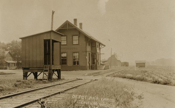 Railway depot and railyard. Caption reads: "Depot and Yards Fitchburg, Wis."