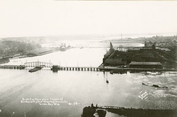 Elevated view from the tower of the Northern Hydro-Electric Power Company on the Fox River. Caption reads: "Bird's Eye View from Tower of Northern Hydro-Electric Power Co. Green Bay, Wis. - No. 59 -".