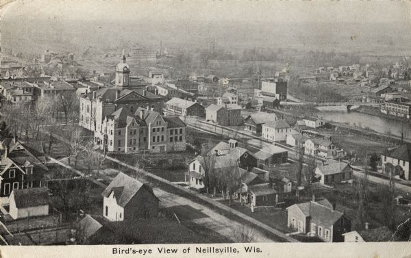 Elevated view of town. Caption reads: "Bird's-eye View of Neillsville, Wis."