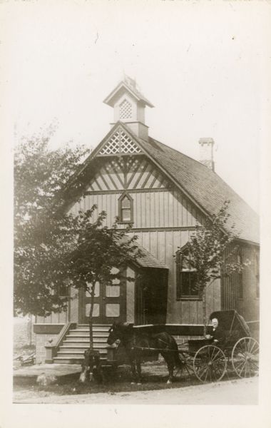 Church of Christ, Scientist, built in 1886, the first Christian Scientist church outside of Boston, Massachusetts, and the first building erected in America specifically for this purpose. There is a man in a horse-drawn buggy in front of church.