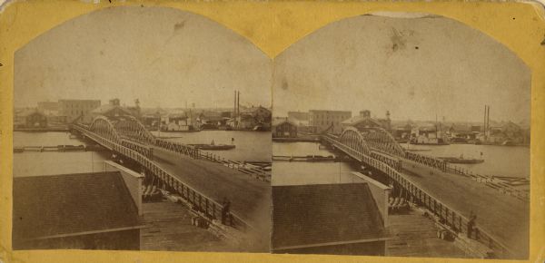 Stereograph of an elevated view of the Main Street bridge, looking toward a section of the city known locally as Brooklyn.