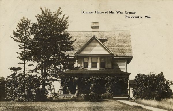 A view of the front of the Cramer residence. Caption reads: "Summer Home of Mrs. William Cramer, Packwaukee, Wis."