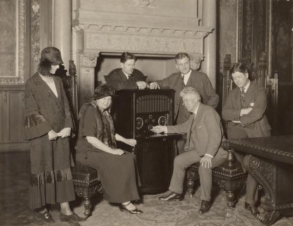 Robert M. La Follette, Sr., with Isabel Bacon La Follette (Mrs. Philip La Follette), Mrs. John J. Blaine, Philip Fox La Follette, Governor John J. Blaine, and Robert M. La Follette, Jr., listening to radio reports of the 1924 election returns in the Executive Chamber in the Wisconsin State Capitol. Senator La Follette was an independent, third-party presidential candidate in the election.