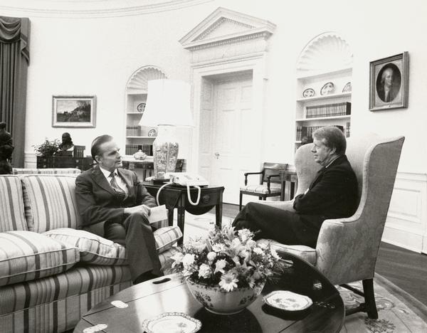 Senator William Proxmire meeting with President Jimmy Carter in the White House.