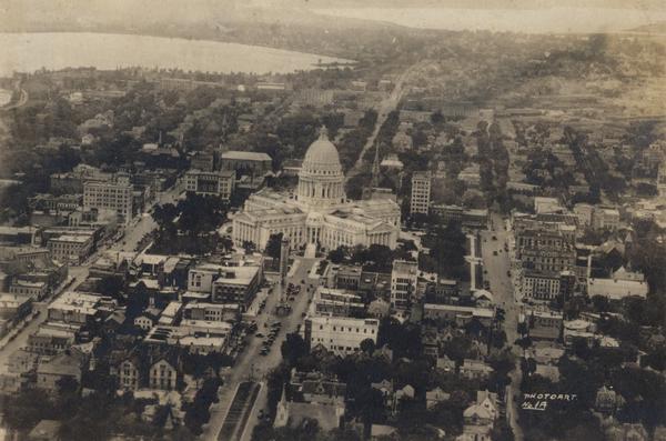 Aerial view of the Capitol Square and surrounding area. Lake Monona and Lake Wingra are in the background.
