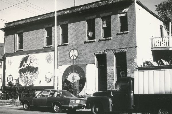 32 North Bassett Street at Mifflin Street, showing a mural on the west facade of the Mifflin Street Community Co-op. The building has been continuously utilized as a grocery store and residence since 1902.