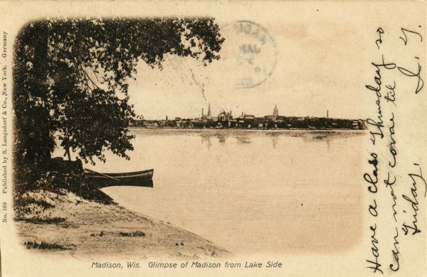 View of Madison from across Lake Monona. A boat is moored near trees at the shoreline of the lake in the foreground. Caption reads: "Madison, Wis. Glimpse of Madison from Lake Side."