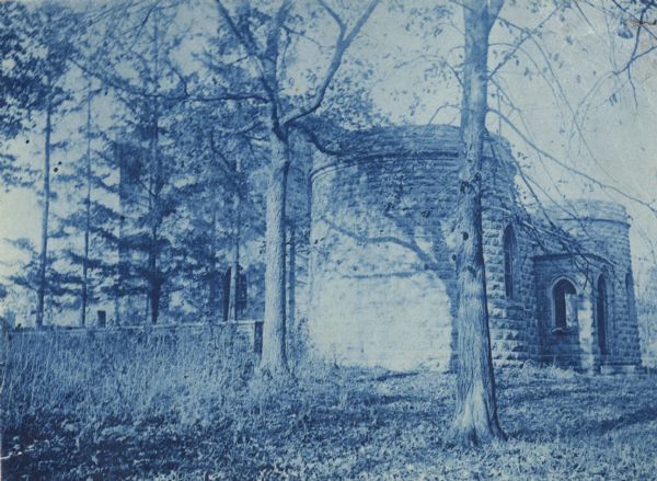 Cyanotype print of the Benjamin Walker Castle, 1862-1893 in the 900 block of East Gorham Street, and its surrounding yard.