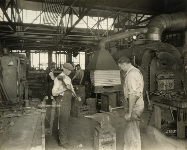 The Blacksmith Shop and workers in the Winther Motor Company factory.